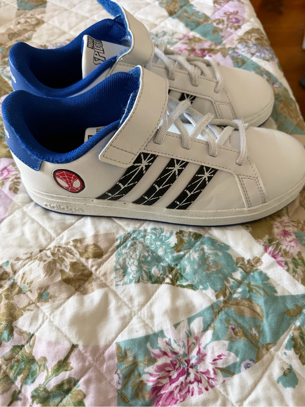 adidas Kids White Sneakers with Blue Lining and Black Stripe Spider Detail